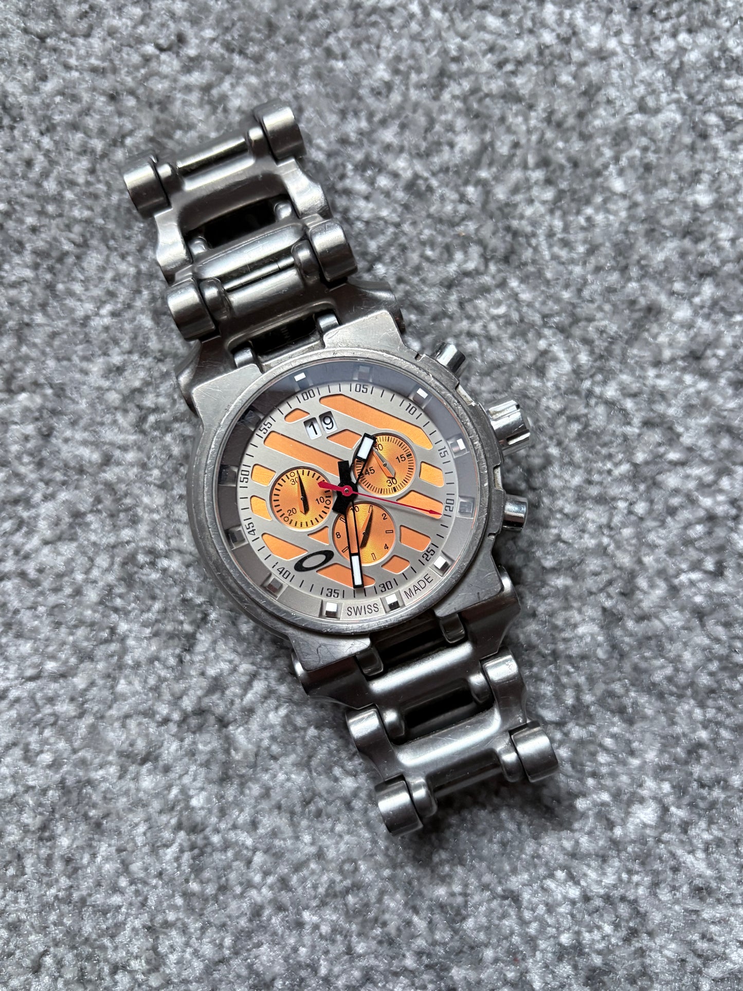 Oakley Hollow Point Orange Dial Titanium Watch
