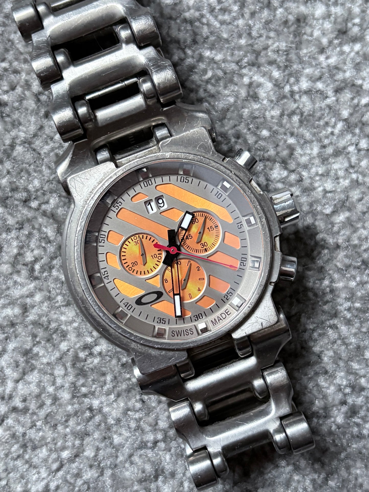 Oakley Hollow Point Orange Dial Titanium Watch