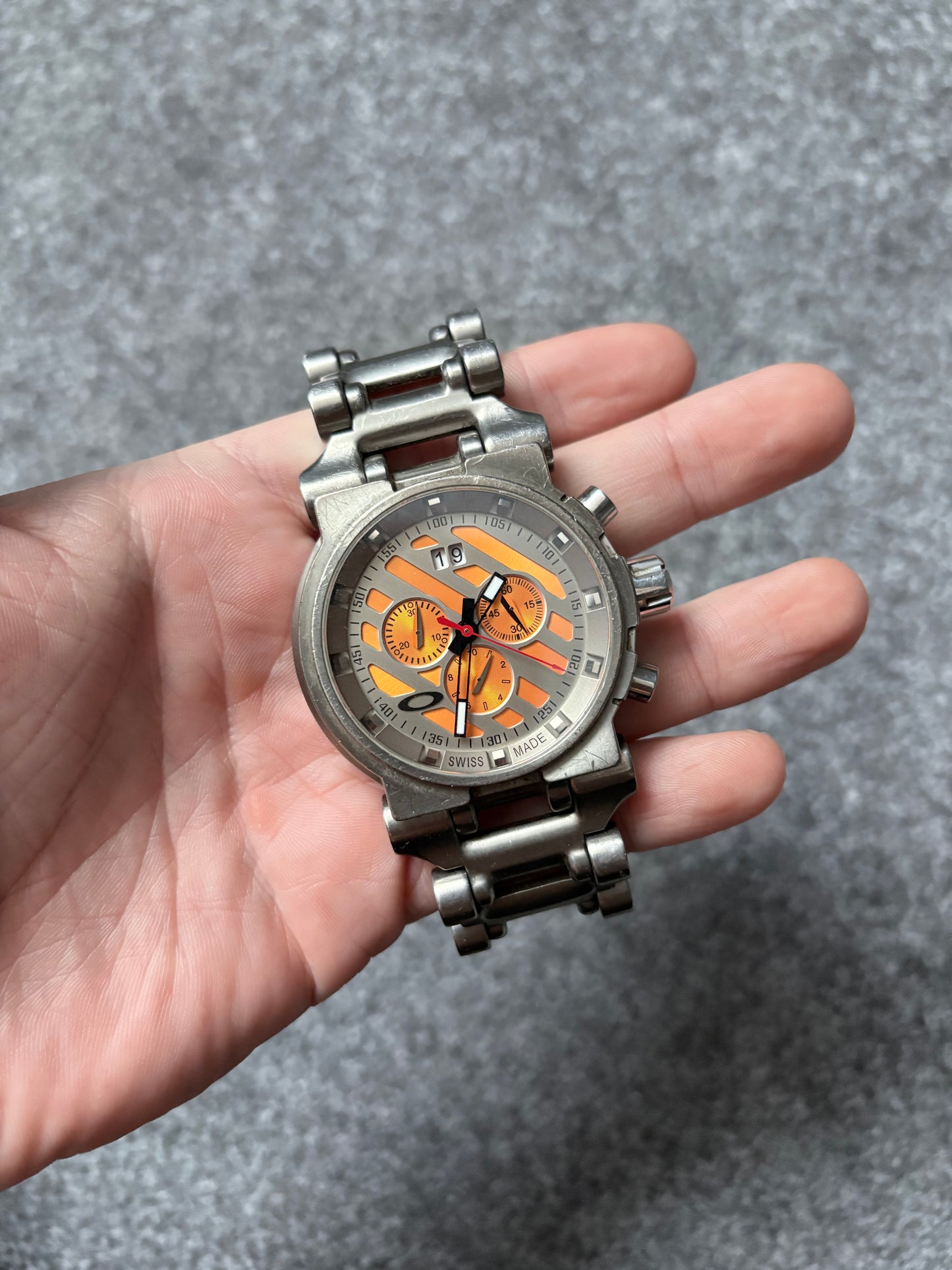 Oakley Hollow Point Orange Dial Titanium Watch