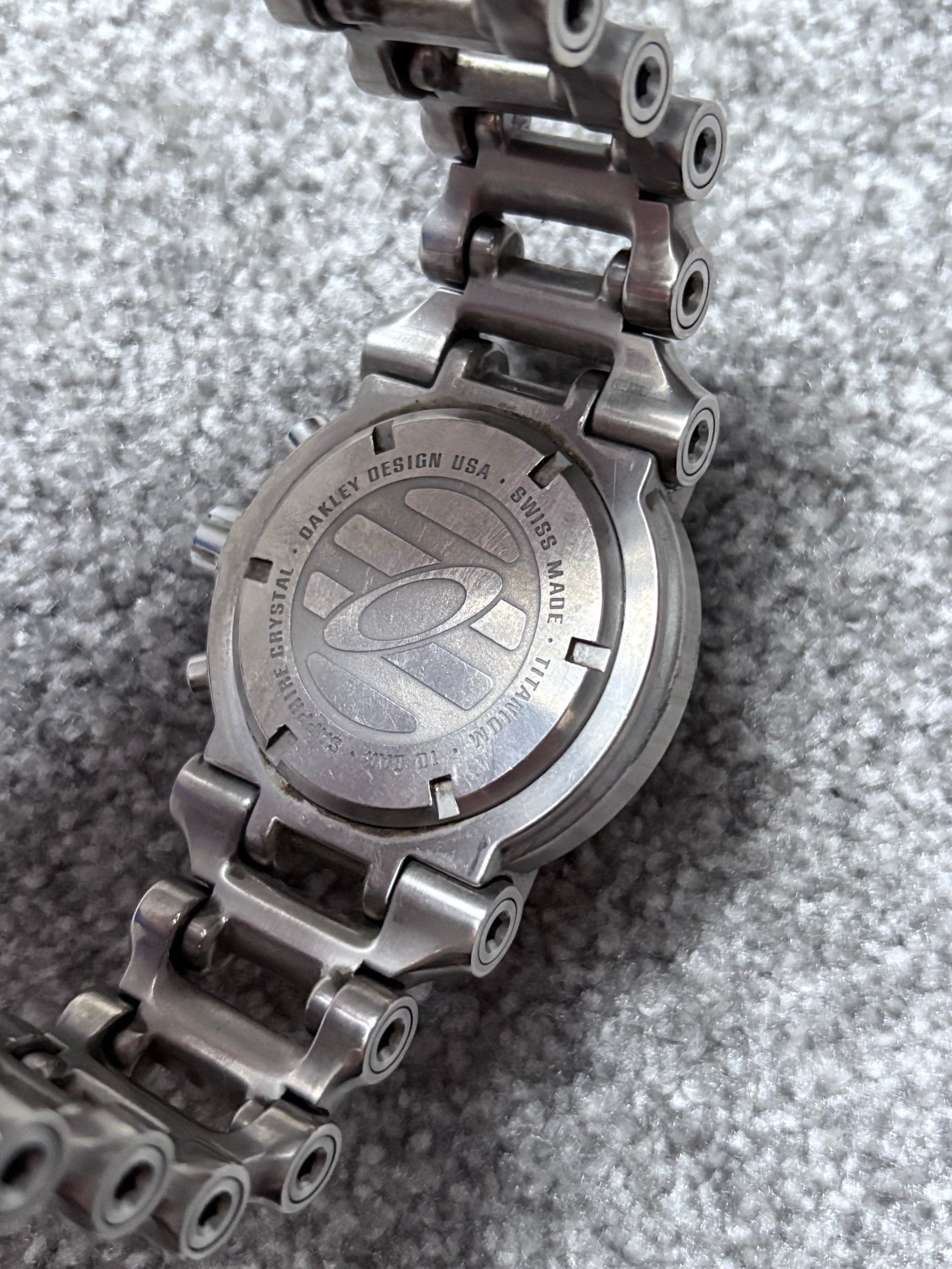Oakley Hollow Point Orange Dial Titanium Watch