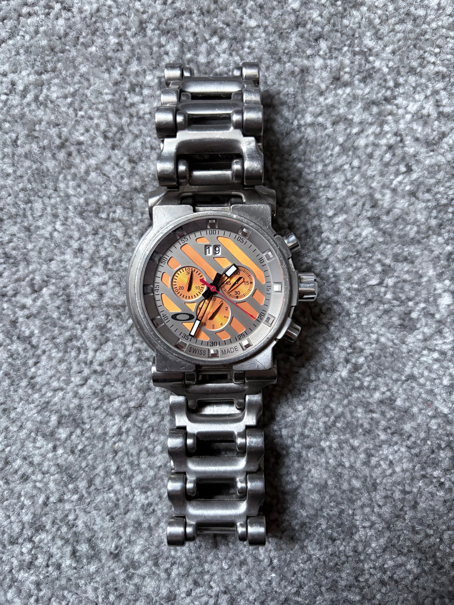 Oakley Hollow Point Orange Dial Titanium Watch